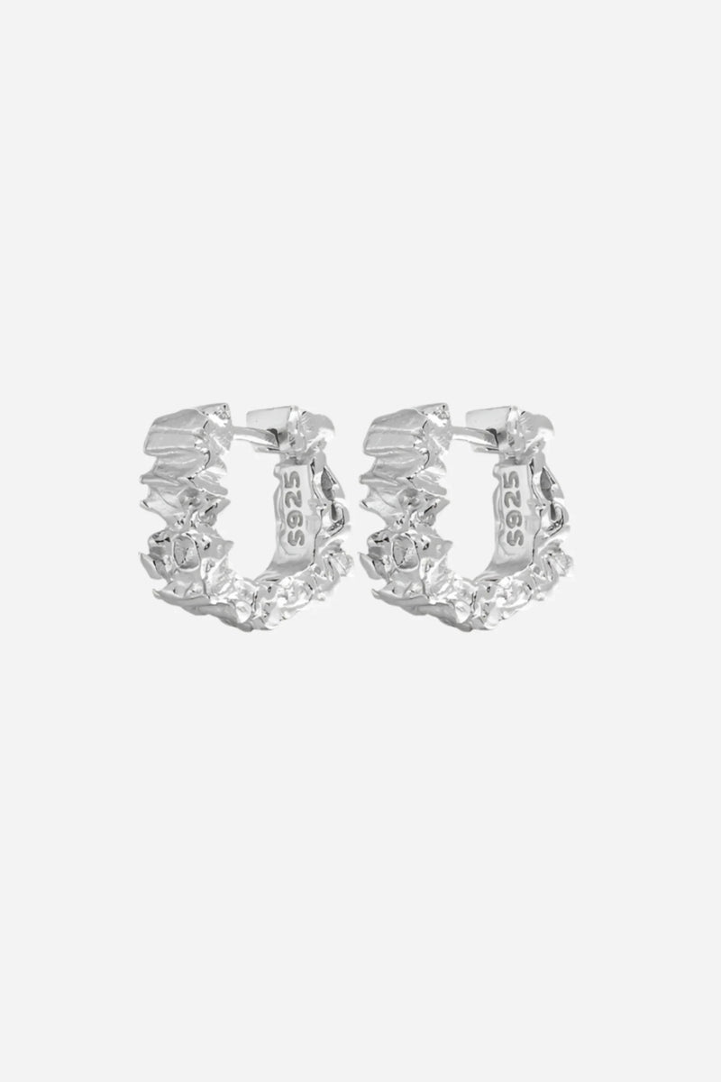 Eva øreringe fra Andcopenhagen Jewelry i 925 sterling sølv, vist som et sæt på hvid baggrund.