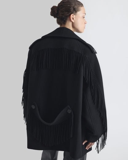 Sort oversized IRO Paris Drifter uldjakke med frynser langs krave, front og ærmer, bred reverskrave og dobbeltradet knaplukning bagfra