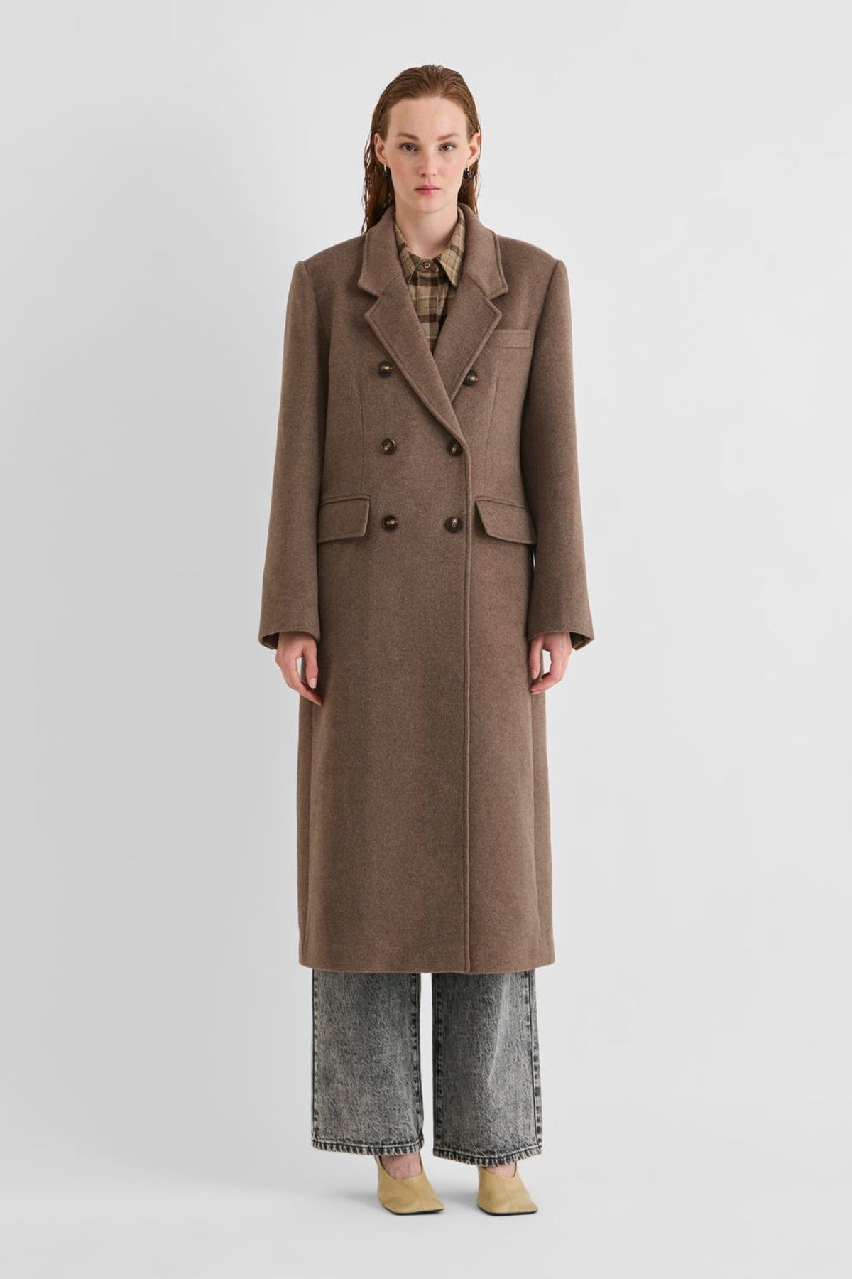 Vila Rouriley long sleeve coat in dark brown wool blend, featuring a double-breasted button closure, worn by a model.