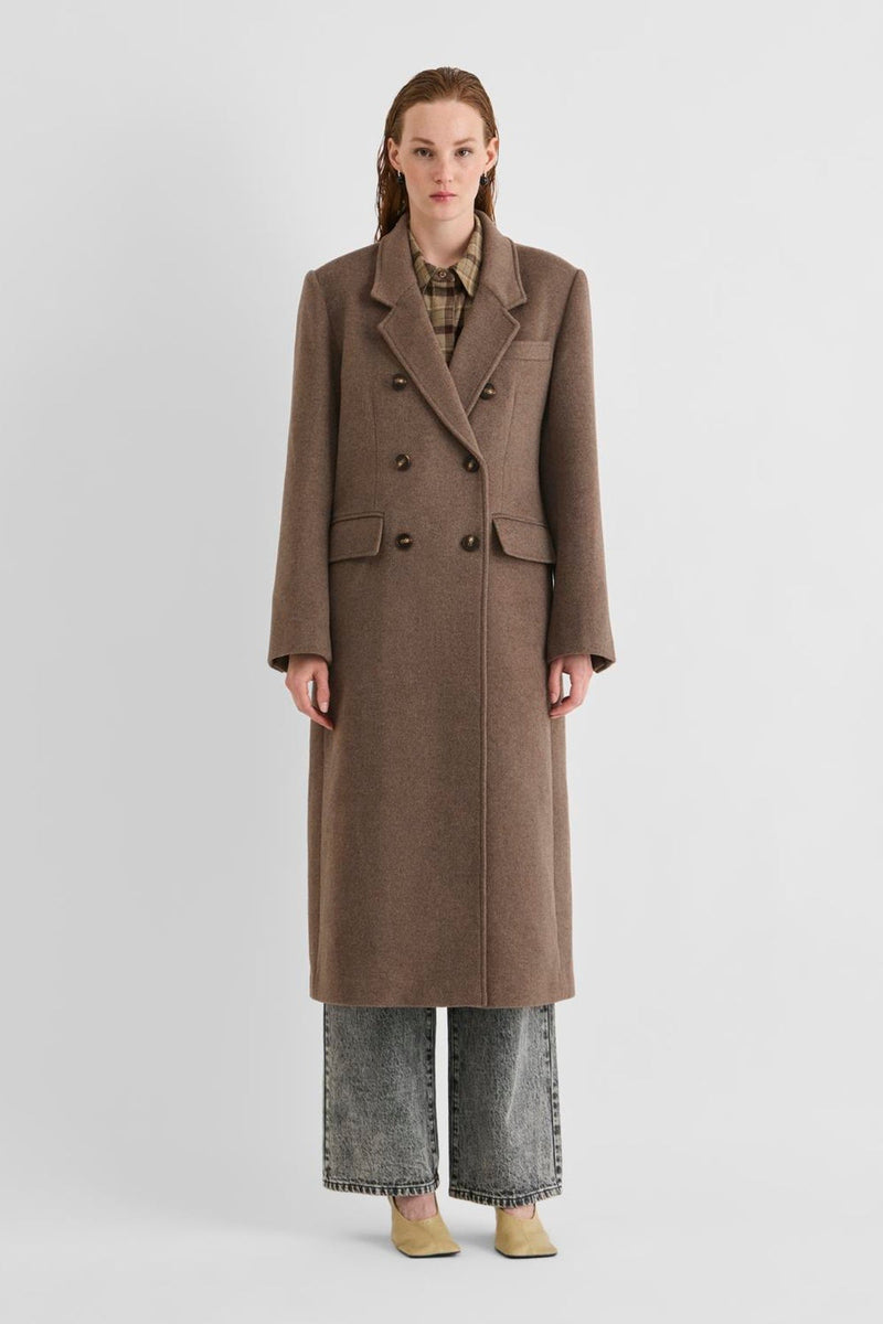 Vila Rouriley long sleeve coat in dark brown wool blend, featuring a double-breasted button closure, worn by a model.